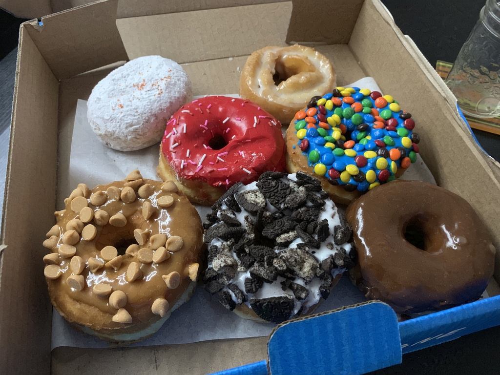 A box of delicious & colourful donuts