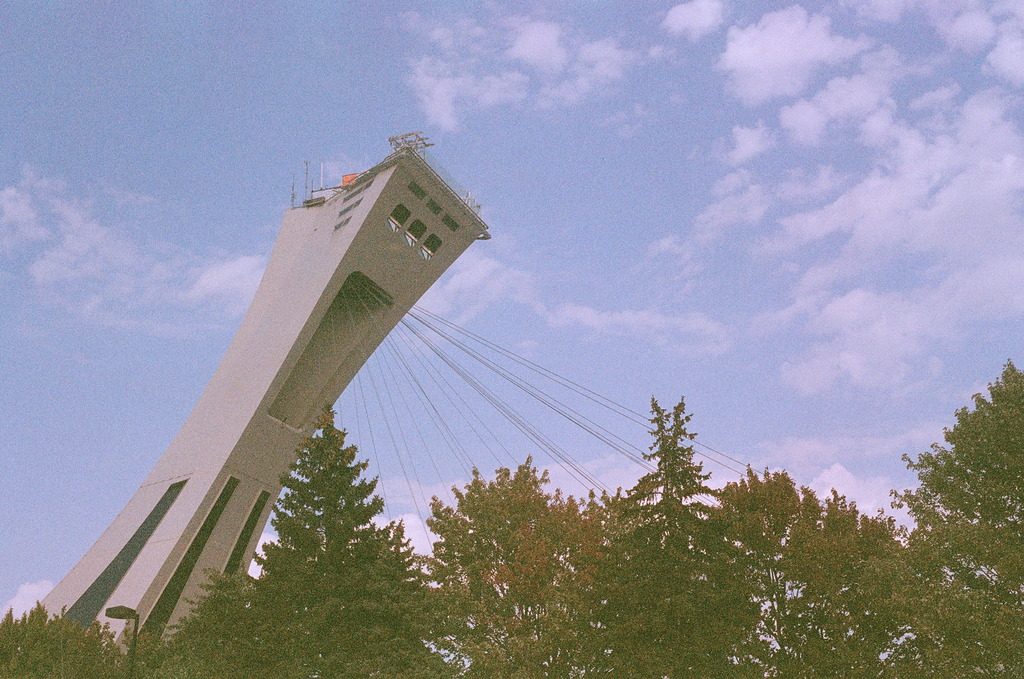 The tower of the Olympic Stadium again, cropped with just some treetops