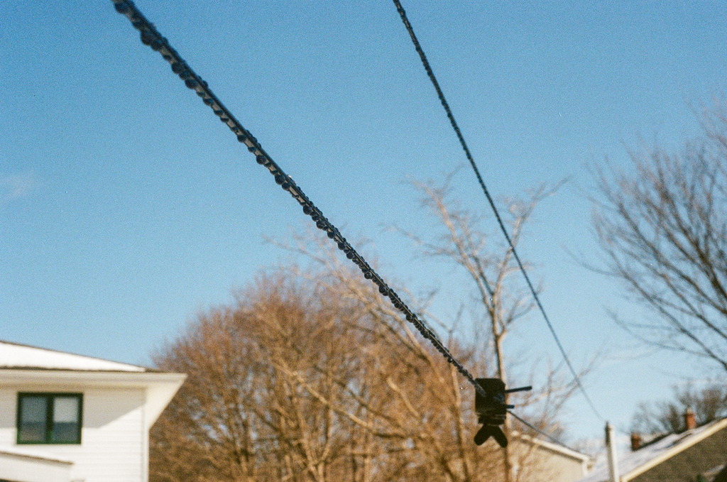 A clothesline with drops of water running along its length
