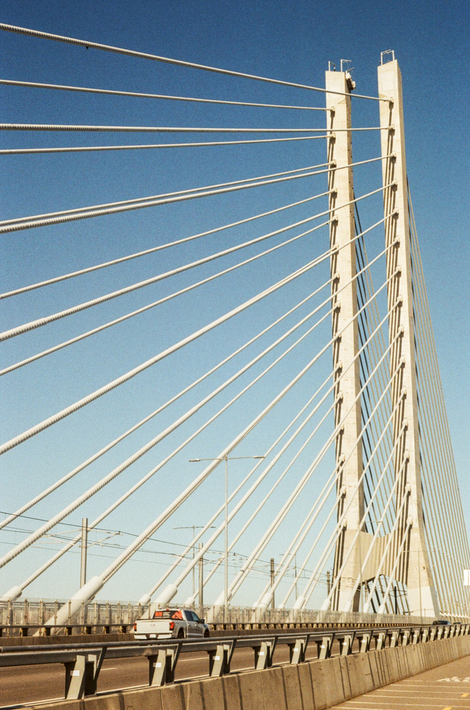 On the bike path of the Champlain bridge, under its tall tower