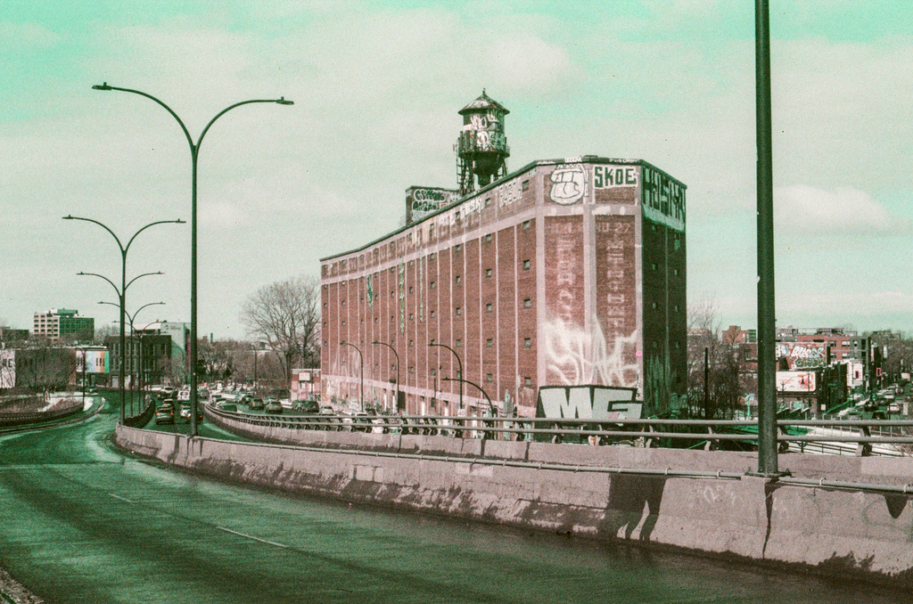 A brick warehouse building with a water tower