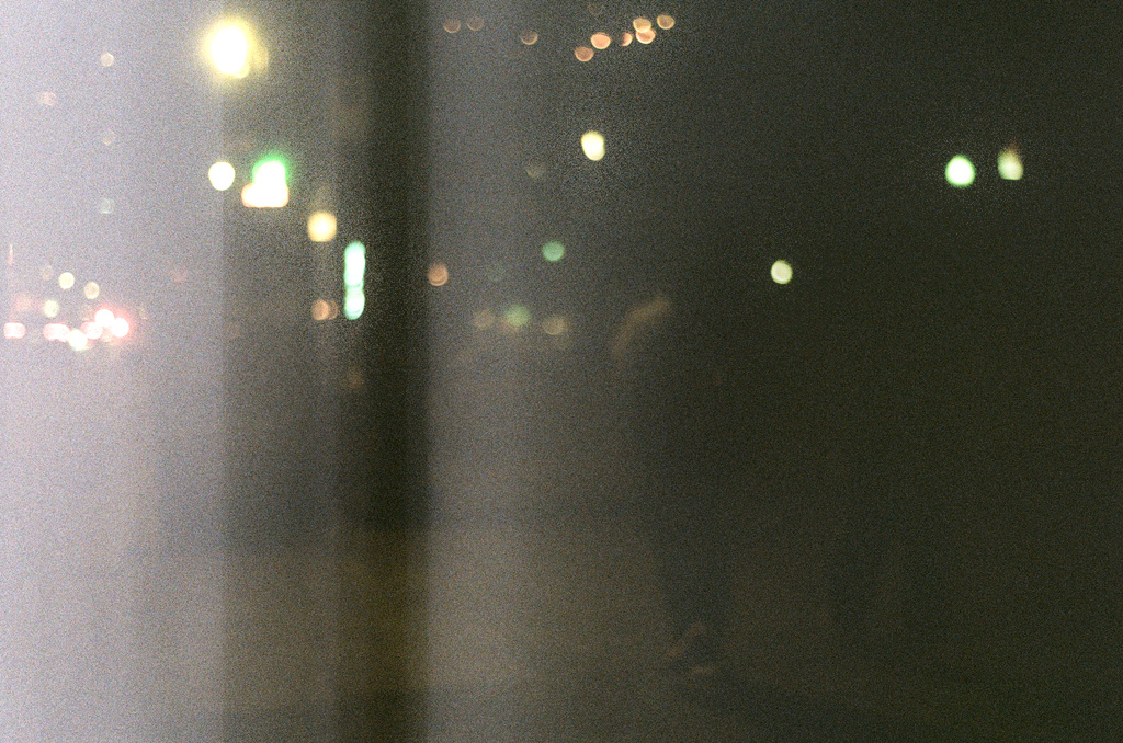 Underexposed night photo with white flare/smear