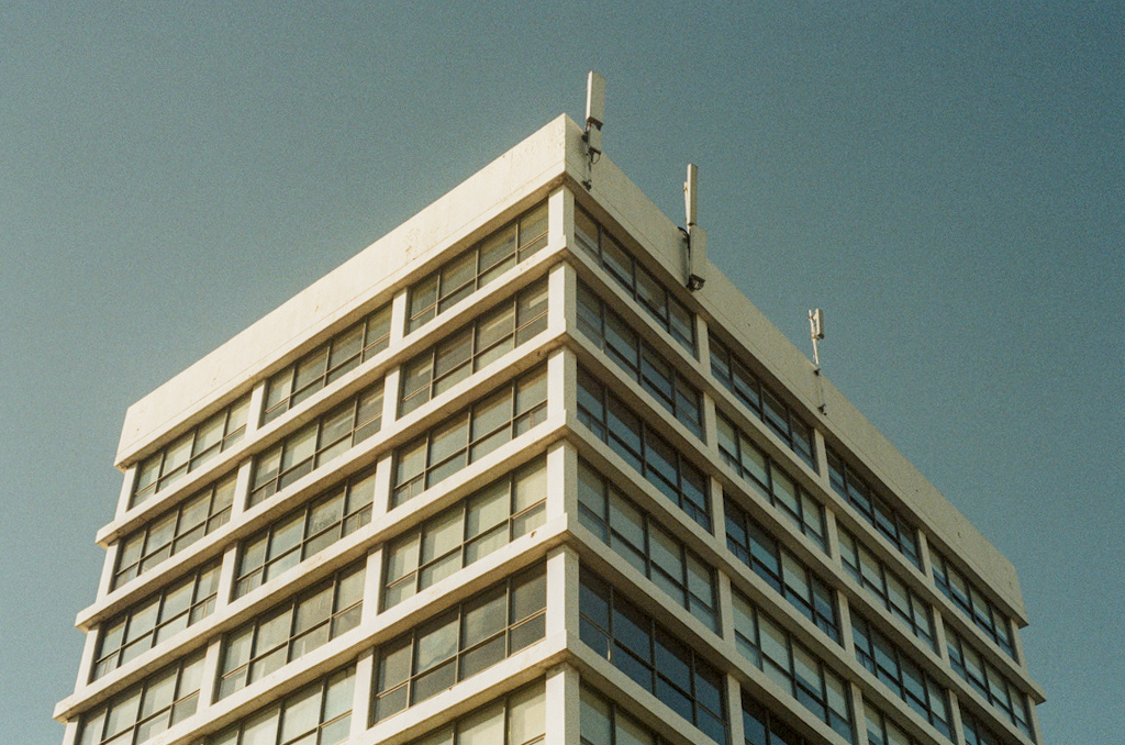 An office building, with different lighting conditions on either face