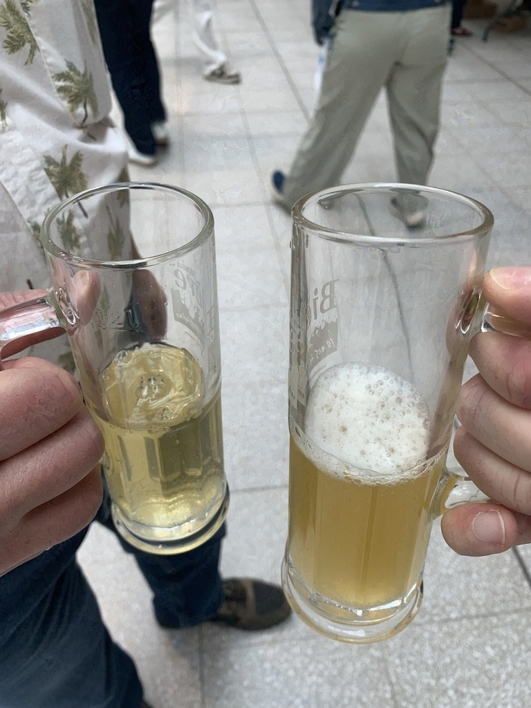 Two tall beer tasting glasses, held together